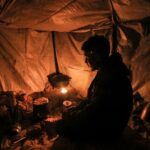 Freezing in makeshift tents, Gazans burn plastic to outlive